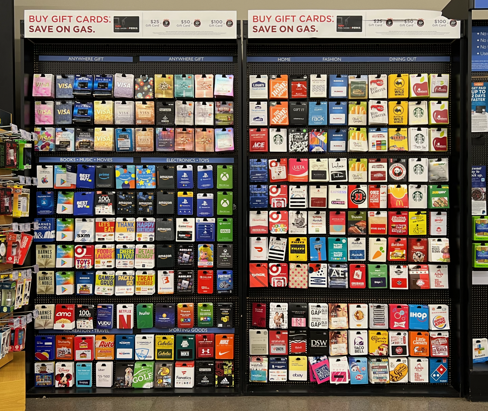 Store display of over 100 different types of gift cards available at a grocery store.