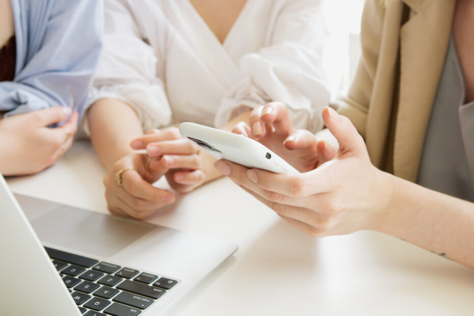 Person holding white wireless computer mouse