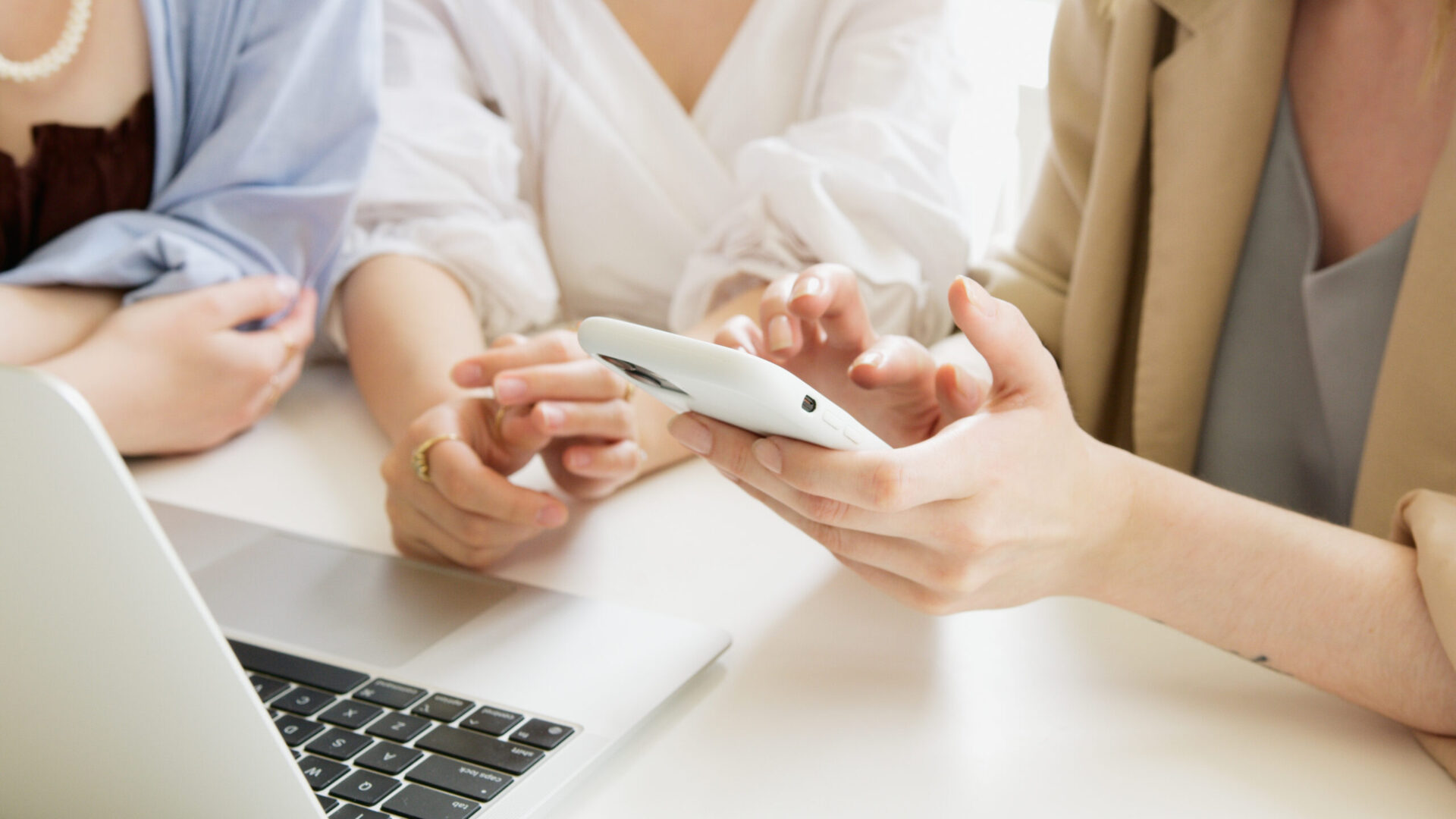 Person holding white wireless computer mouse