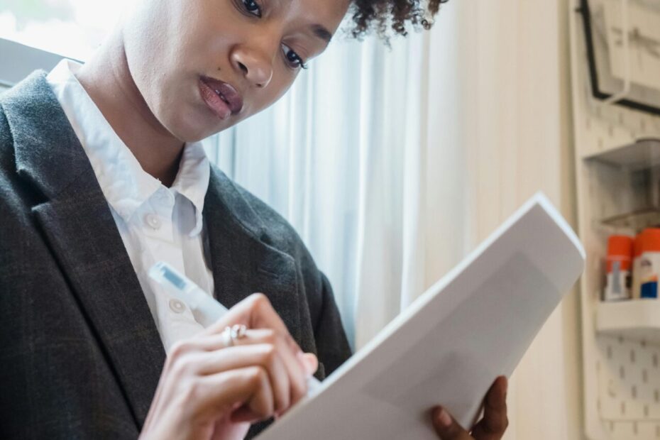 Woman writing on paper